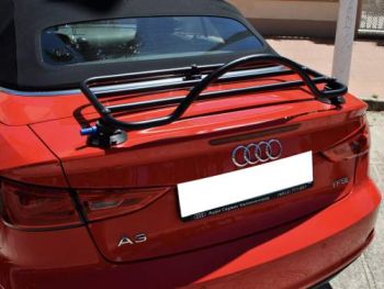 red audi a3 cabriolet with a revo-rack black luggage rack fitted photographed close from the rear on a sunny day