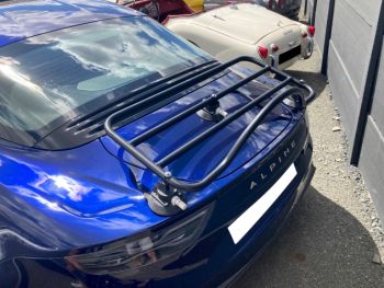 Blue Alpine A110 with a Revo-Rack black luggage rack fitted photographed close at the rear 