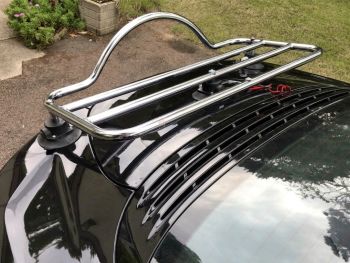 Black Alpine A110 with a revo-rack chrome polished luggage rack fitted photographed close at the rear 