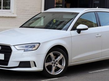Blue Audi a3 Hatch-back with a bike rack fitted photographed close from the side