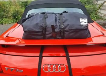 red audi tt mk3 typ8s cabrio roadster convertible with a boot-bag luggage rack fitted photographed close at the rear 
