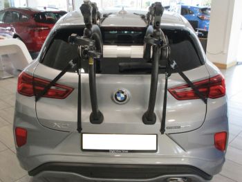 silver bmw x2 f39 with a 3 bike rack fitted photographed close form the rear