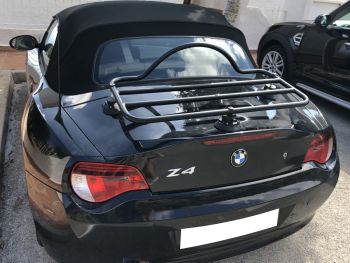 Black bmw z4 e85 with a black luggage rack fitted photogprahed close from the side