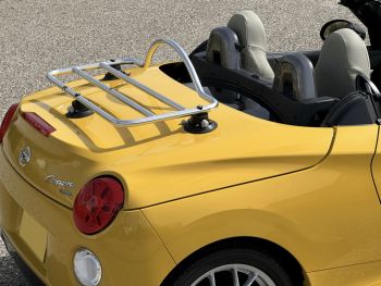 yellow daihatsu copen with a revo-rack pa chrome stainless steel luggage rack fitted photogprahed close from the side 
