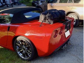 red corvette c6 convertible with a boot-bag luggage rack fitted photographed close from the rear