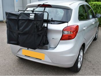 Silver Ford KA+ with a hatch-bag roof box alternative fitted photographed close at the rear 