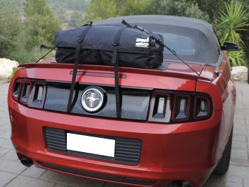5th gen burgandy ford mustang cabrio with a boot-bag original luggage bag rack fitted photographed close from the rear 