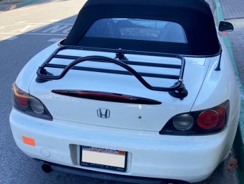 white honda s2000 with a revo-rack black luggage rack fitted to the trunk/boot lid photographed close from the rear