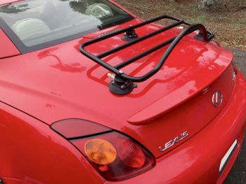 Side view of a red lexus sc430 with a black luggage rack fitted 
