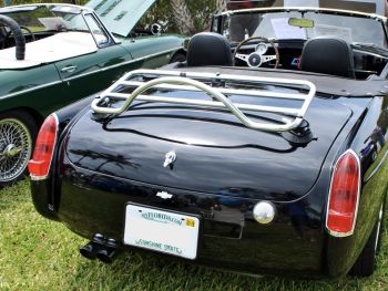 black MGB at a car show with a revo-rack pa luggage rack fitted photographed from the rear