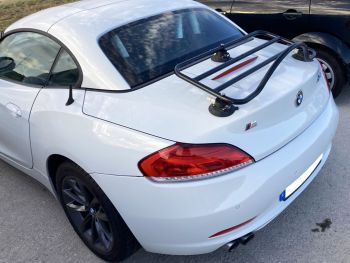 White bmw z4 e89 in a car park photographed close at the rear with a black revo-rack luggage rack fitted 