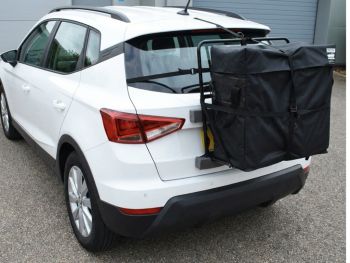 white Seat Arona with a hatchbag roof box alternative fitted photographed close at the rear 