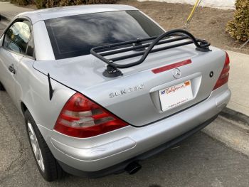 silver mercedes benz slk R170 with a revo-rack luggage rack fitted photographed parked by the kerb