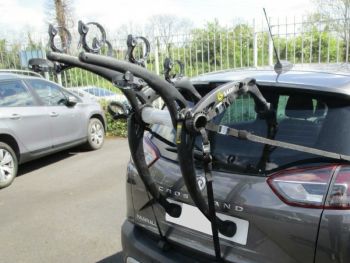 graphite Vauxhall Crossland with a bike rack fitted top the tailgate photogprahed in car park close form the rear focusing on the bike rack