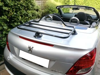 silver peugeot 207cc with the roof down and revo-rack luggage rack fitted