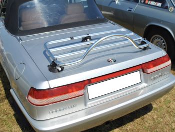 silver alfa romeo spider with a stainless steel boot rack fitted 