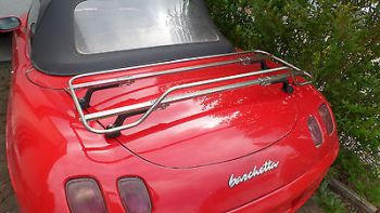 red fiat barchetta with a stainless steel luggage rack fitted