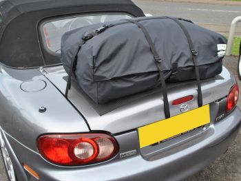 miata nb rack boot-bag vacation on a grey mx5 nb photographed from the rear