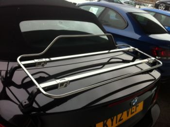 black bmw 1 series convertible with a stainless steel luggage rack fitted