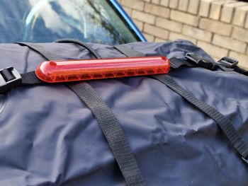 Luggage strap with integrated third brake light