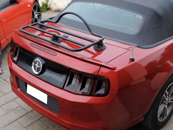 5th generation ford mustang convertible in dark red with a revo-rack luggage rack fitted to the trunk lid