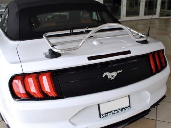 White ford mustang convertible with a revo-rack pa trunk rack attached
