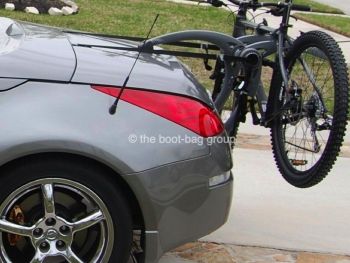 grey nissan 350z roadster with a bike rack fitted