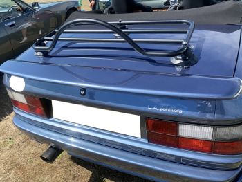 blue Porsche 944 convertible with the roof down and a revo-rack black luggage rack fitted  