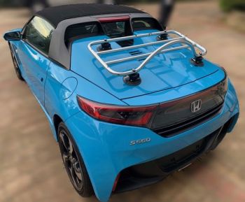 Blue Honda S660 with a chrome luggage rack fitted to the rear 