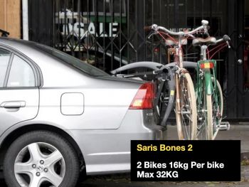 silver honda civic saloon with a saris bones 2 bike rack fitted carrying two bikes photographed from the side