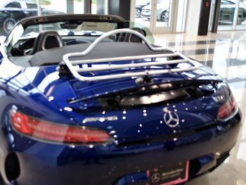 Blue AMG GTC with the roof doen in a mercedes dealership with a revo-rack pa luggage rack fitted to the boot/trunk